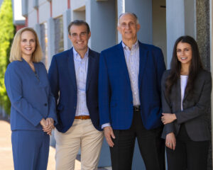 four attorneys of Jebaily Law Firm standing outside Florence office